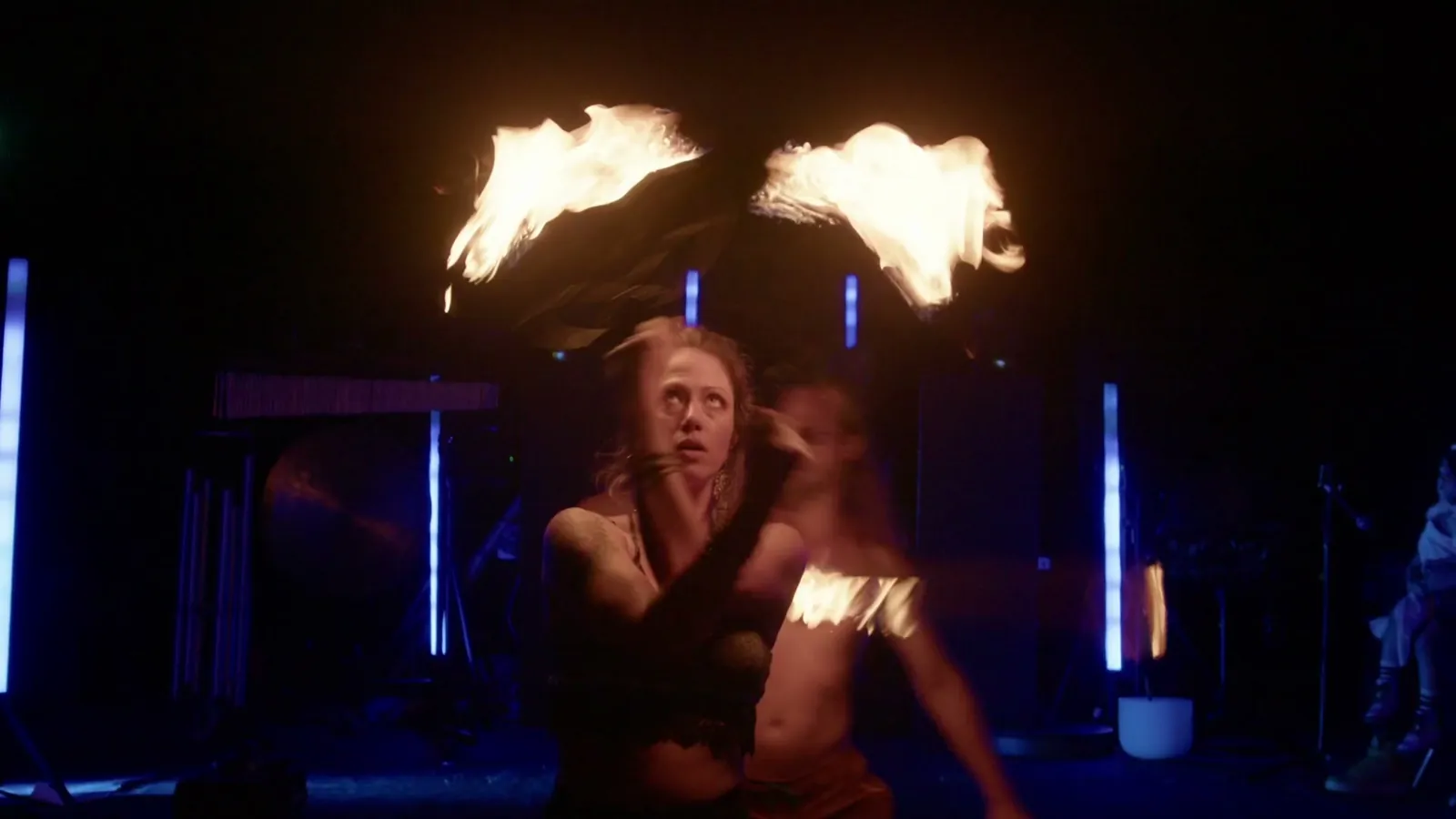 Fire fans lit overhead on stage during a Great Medicine Show set